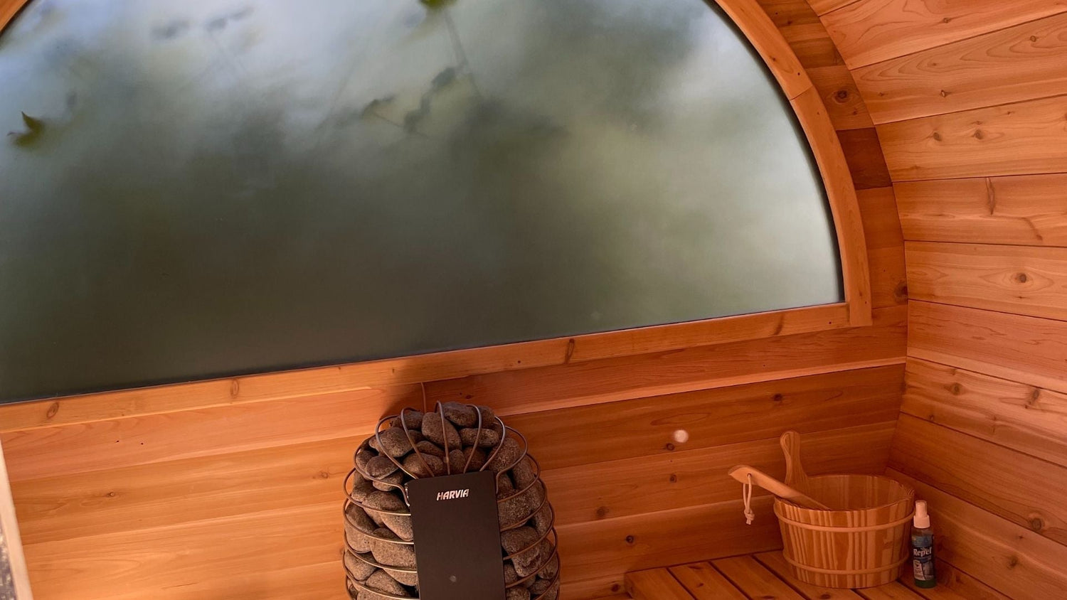 warm cedar outdoor sauna with steamed window